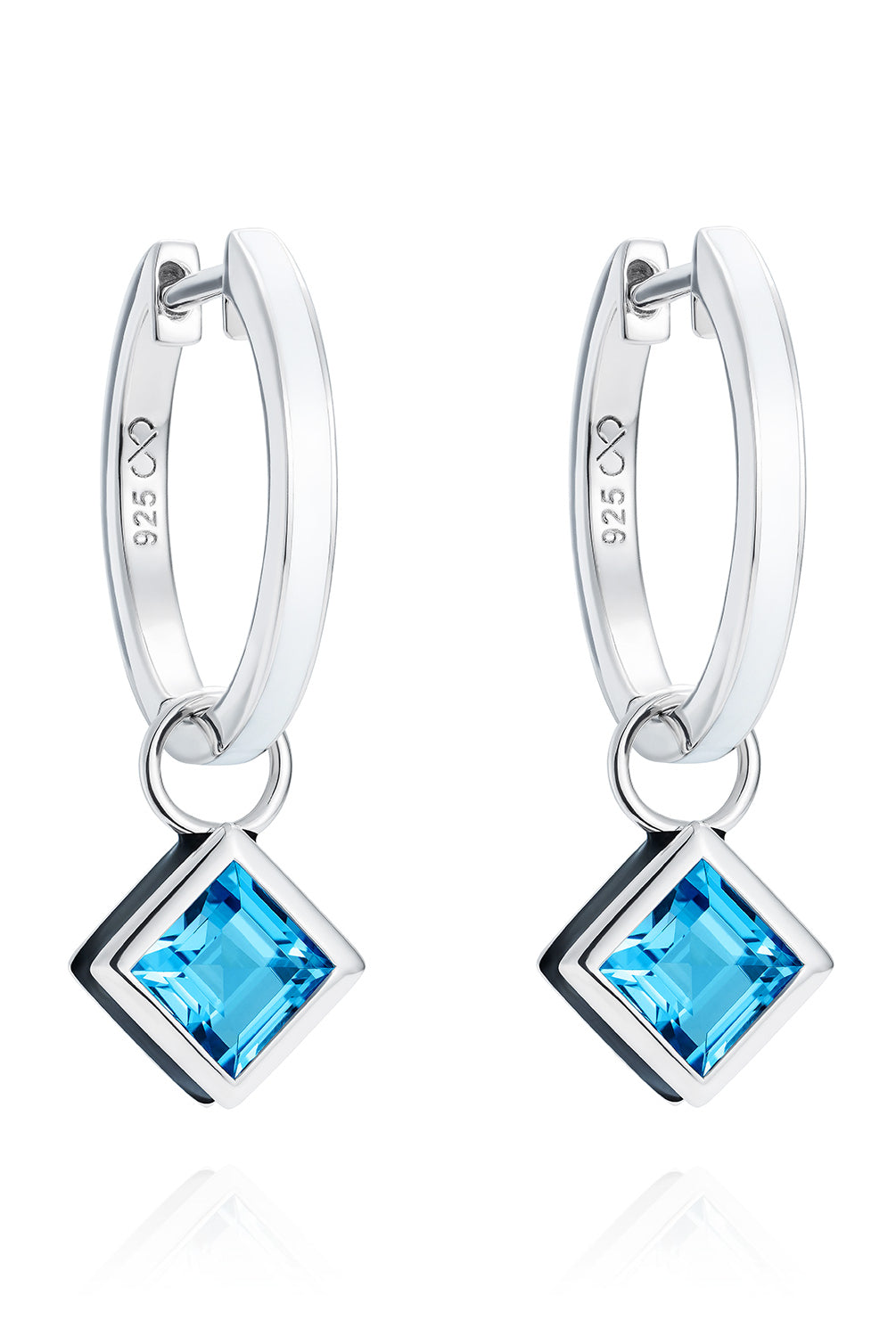 Reversible sterling silver hoop earrings with square blue topaz drops, hand-applied black enamel on one side and white enamel on the other - Something Blue By Ostro