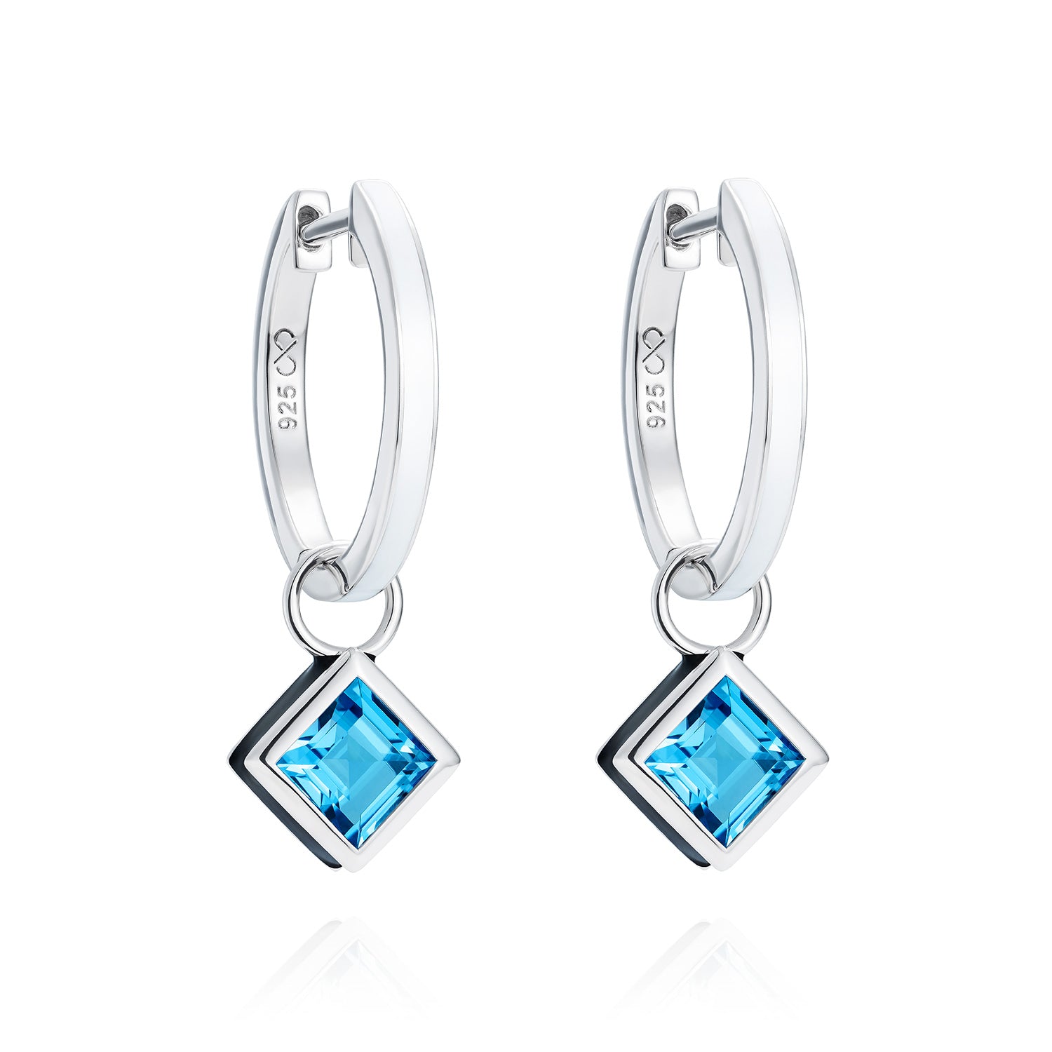 Reversible sterling silver hoop earrings with square blue topaz drops, hand-applied black enamel on one side and white enamel on the other - Something Blue By Ostro