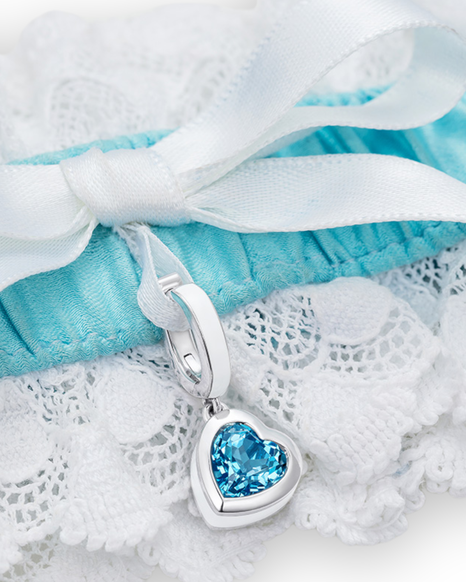 Wedding garter with heart-shaped blue topaz charm in sterling silver - Something Blue By Ostro